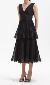 NANCY SLEEVELESS PLEATED TIERED MIDI DRESS IN BLACK