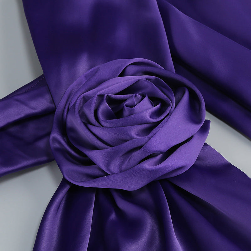 satin wrap halter gown with flower in purple